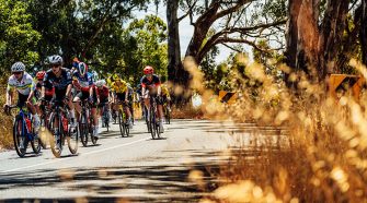 Ally Wollaston shines at the Santos Tour Down Under Women's Race, facing challenges ahead with determination and team support.